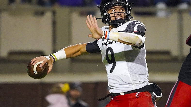 Nov 26, 2021; Greenville, North Carolina, USA; Cincinnati Bearcats quarterback Desmond Ridder (9) throws the ball during the second half against the East Carolina Pirates at Dowdy-Ficklen Stadium. Mandatory Credit: James Guillory-USA TODAY Sports