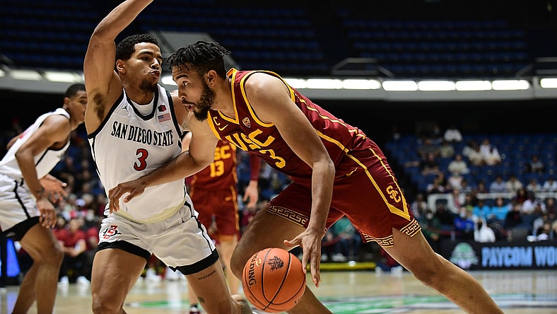 Nov 26, 2021; Anaheim, CA, USA; Southern California Trojans forward Isaiah Mobley (3) moves the ball against San Diego State Aztecs guard Matt Bradley (3) during the first half of the Wooden Legacy at Anaheim Arena. Mandatory Credit: Gary A. Vasquez-USA TODAY Sports