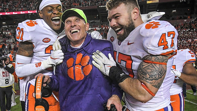 Clemson defensive coordinator Brent Venables is dunked with sports drink by linebacker James Skalski (47) and linebacker Baylon Spector (10) with corner back Mario Goodrich (31) after the game at Williams Brice Stadium in Columbia, South Carolina Saturday, November 27, 2021.  Clemson won 30-0.

Clemson U Of Sc Football In Columbia