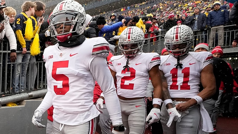 Ohio State Buckeyes wide receivers Garrett Wilson (5), Chris Olave (2) and Jaxon Smith-Njigba (11) take the the field for the NCAA football game against the Michigan Wolverines at Michigan Stadium in Ann Arbor on Sunday, Nov. 28, 2021.
Ohio State Buckeyes At Michigan Wolverines