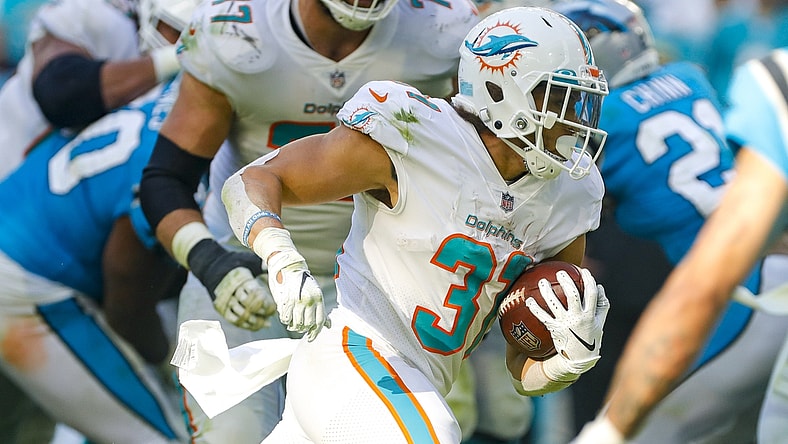 Nov 28, 2021; Miami Gardens, Florida, USA; Miami Dolphins running back Phillip Lindsay (31) runs with the football against the Carolina Panthers during the fourth quarter at Hard Rock Stadium. Mandatory Credit: Sam Navarro-USA TODAY Sports