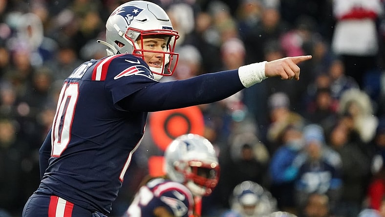 Nov 28, 2021; Foxborough, Massachusetts, USA; New England Patriots quarterback Mac Jones (10) on the line of scrimmage against the Tennessee Titans in the second half at Gillette Stadium. Mandatory Credit: David Butler II-USA TODAY Sports