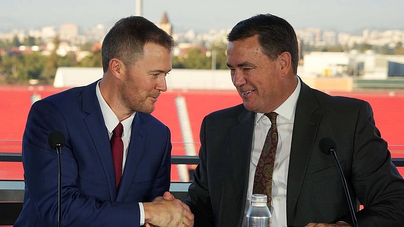Nov 29, 2021; Los Angeles, CA, USA; Lincoln Riley (left) and Southern California Trojans athletic director Mike Bohn shake hands during a press conference to introduce Riley as USC head coach at the Los Angeles Memorial Coliseum. Mandatory Credit: Kirby Lee-USA TODAY Sports