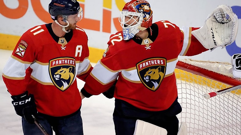 Nov 30, 2021; Sunrise, Florida, USA; Florida Panthers left wing Jonathan Huberdeau (11) talks with goaltender Sergei Bobrovsky (72) during the third period against the Washington Capitals at FLA Live Arena. Mandatory Credit: Jasen Vinlove-USA TODAY Sports