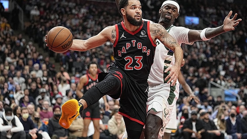 Dec 2, 2021; Toronto, Ontario, CAN; Toronto Raptors guard Fred VanVleet (23) passes the ball as Milwaukee Bucks center Bobby Portis (9) defends during the second quarter at Scotiabank Arena. Mandatory Credit: John E. Sokolowski-USA TODAY Sports