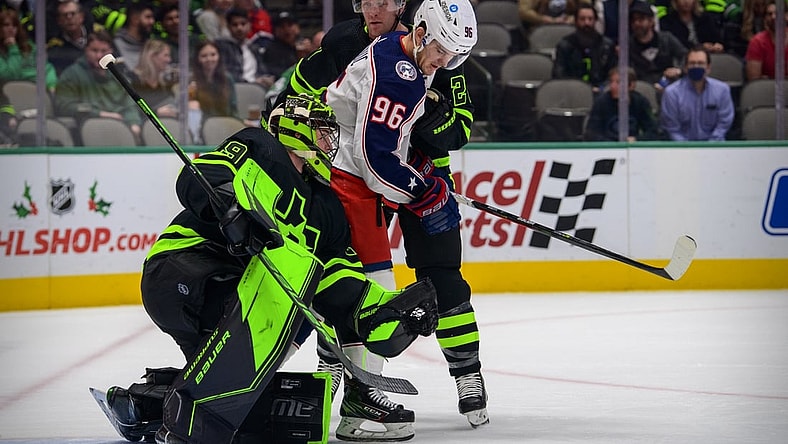 Dec 2, 2021; Dallas, Texas, USA; Dallas Stars defenseman Ryan Suter (20) and goaltender Jake Oettinger (29) defend against Columbus Blue Jackets center Jack Roslovic (96) during the first period at the  American Airlines Center. Mandatory Credit: Jerome Miron-USA TODAY Sports