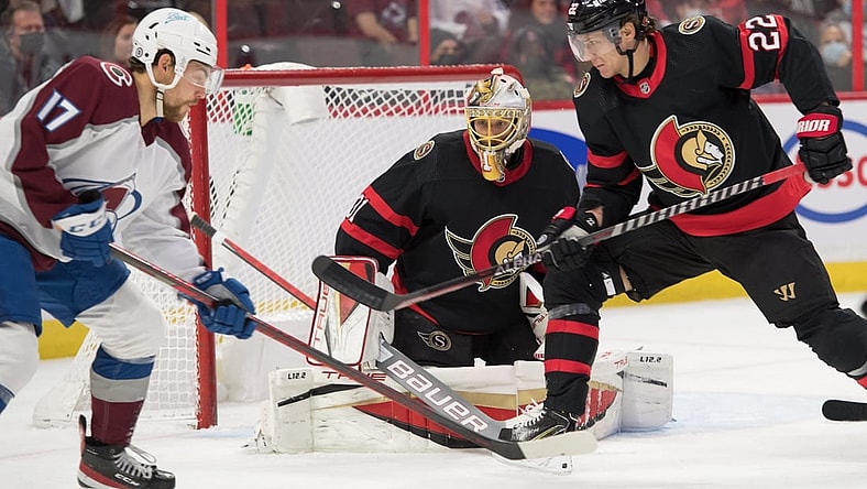 Dec 4, 2021; Ottawa, Ontario, CAN; Colorado Avalanche center Tyson Jost (17) battles with Ottawa Senators defenseman Nikita Zaitsev (22) in the first period at the Canadian Tire Centre. Mandatory Credit: Marc DesRosiers-USA TODAY Sports