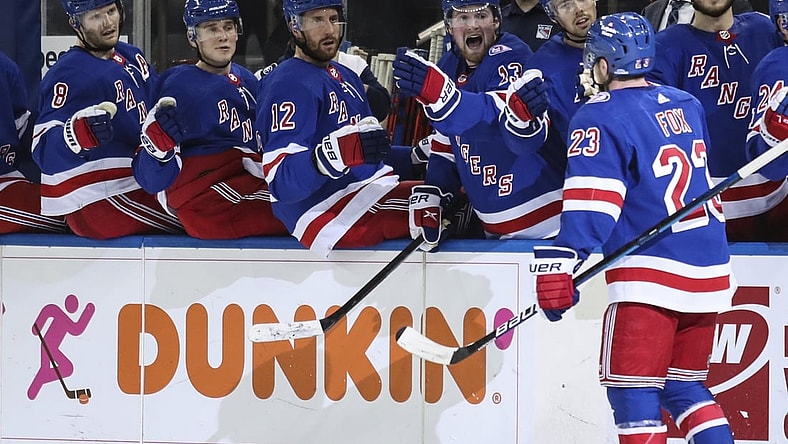 Dec 4, 2021; New York, New York, USA; New York Rangers defenseman Adam Fox (23) celebrates with teammates after scoring a goal against the Chicago Blackhawks in the second period at Madison Square Garden. Mandatory Credit: Wendell Cruz-USA TODAY Sports