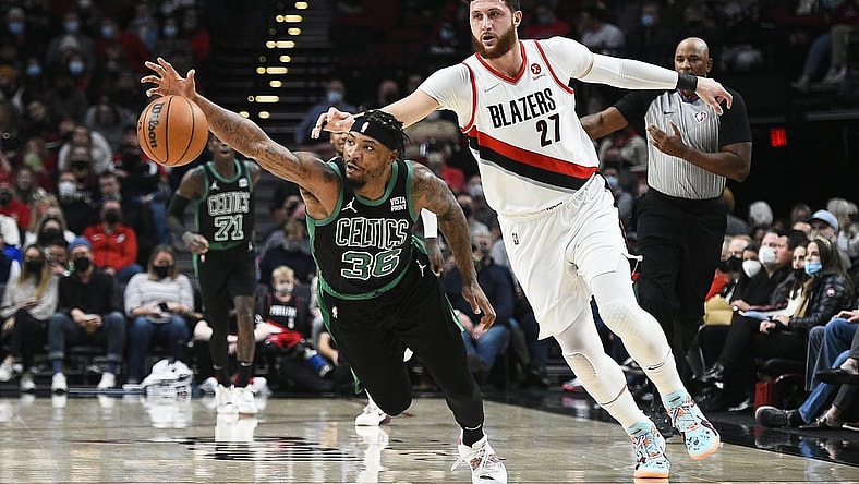 Dec 4, 2021; Portland, Oregon, USA; Boston Celtics guard Marcus Smart (36) steals the ball away from Portland Trail Blazers center Jusuf Nurkic (27) during the first half at Moda Center. Mandatory Credit: Troy Wayrynen-USA TODAY Sports