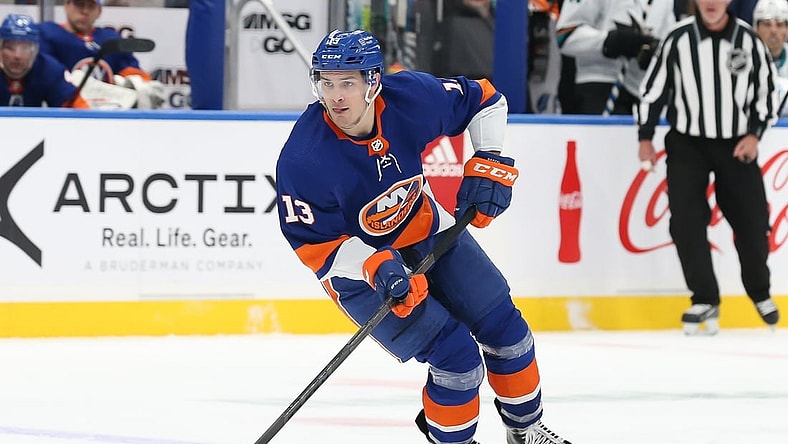 Dec 2, 2021; Elmont, New York, USA; New York Islanders center Mathew Barzal (13) skates with the puck against San Jose Sharks during the second period at UBS Arena. Mandatory Credit: Tom Horak-USA TODAY Sports