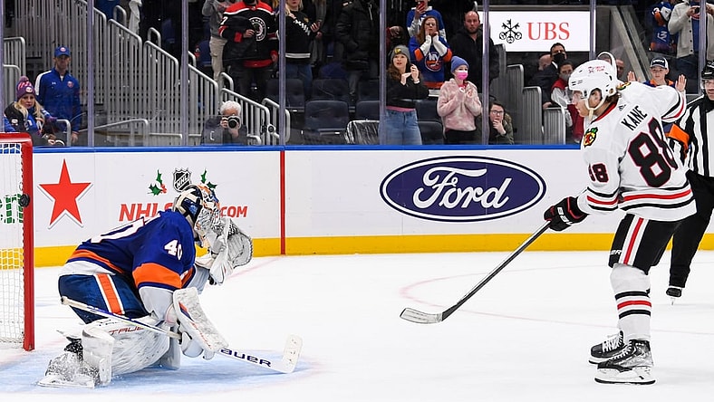 Dec 5, 2021; Elmont, New York, USA; Chicago Blackhawks right wing Patrick Kane (88) scores the wining goal on New York Islanders goaltender Semyon Varlamov (40) during shootouts  at UBS Arena. Mandatory Credit: Dennis Schneidler-USA TODAY Sports