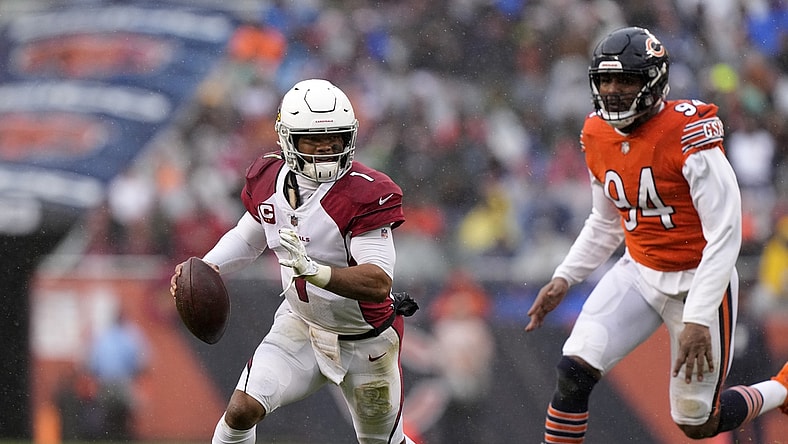 Dec 5, 2021; Chicago, Illinois, USA; Arizona Cardinals quarterback Kyler Murray (1) avoids the tackle of Chicago Bears outside linebacker Robert Quinn (94) during the first quarter at Soldier Field. Mandatory Credit: Mike Dinovo-USA TODAY Sports