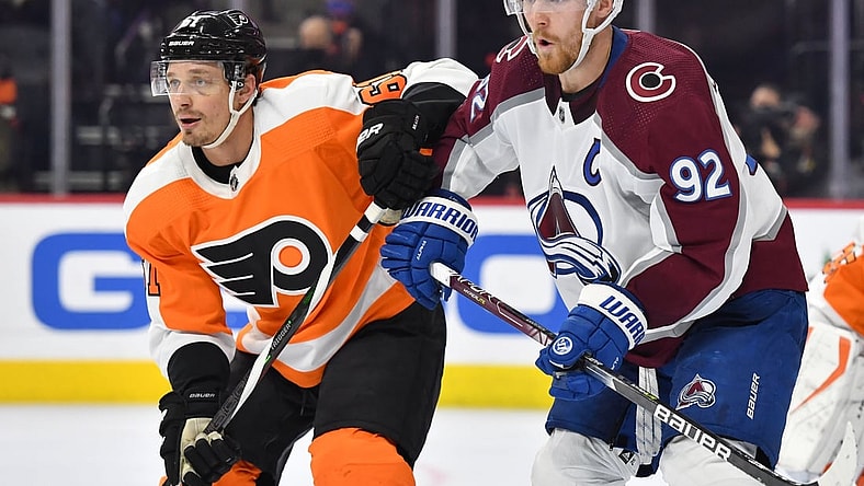 Dec 6, 2021; Philadelphia, Pennsylvania, USA; Colorado Avalanche left wing Gabriel Landeskog (92) and Philadelphia Flyers defenseman Justin Braun (61) battle for position during the second period at Wells Fargo Center. Mandatory Credit: Eric Hartline-USA TODAY Sports