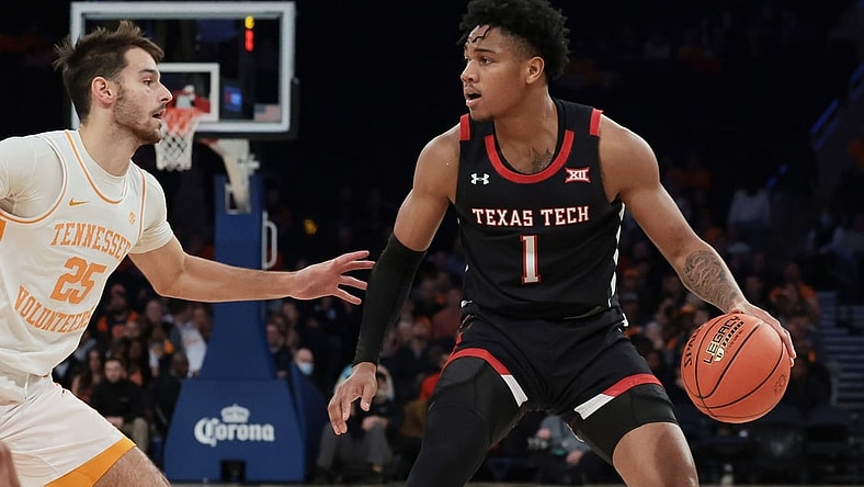 Dec 7, 2021; New York, New York, USA; Texas Tech Red Raiders guard Terrence Shannon Jr. (1) dribbles as Tennessee Volunteers guard Santiago Vescovi (25) defends during the second half at Madison Square Garden. Mandatory Credit: Vincent Carchietta-USA TODAY Sports