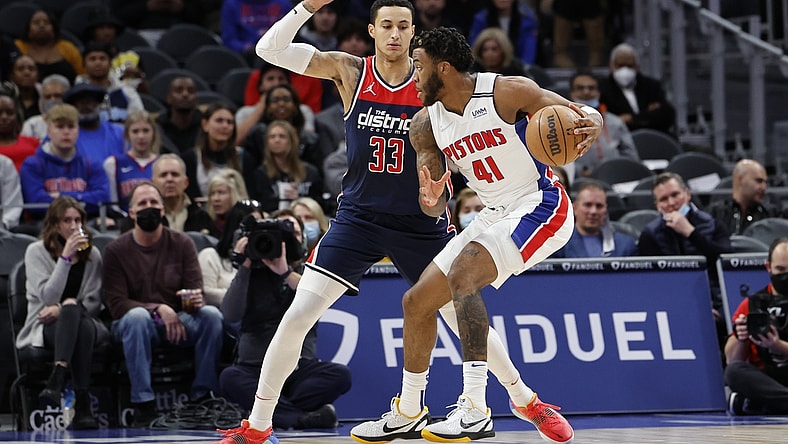 Dec 8, 2021; Detroit, Michigan, USA;  Detroit Pistons forward Saddiq Bey (41) dribbles defended by Washington Wizards forward Kyle Kuzma (33) in the first half at Little Caesars Arena. Mandatory Credit: Rick Osentoski-USA TODAY Sports