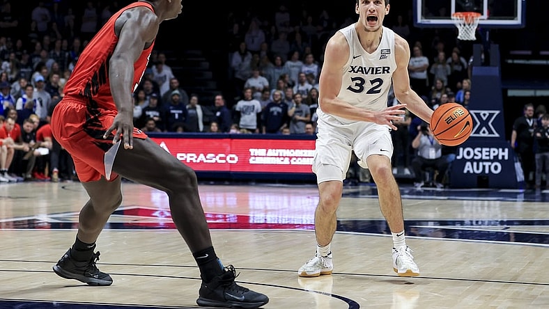 Dec 8, 2021; Cincinnati, Ohio, USA;  Xavier Musketeers forward Zach Freemantle (32) yells to teammates as he controls the ball against the Ball State Cardinals in the second half at the Cintas Center. Mandatory Credit: Aaron Doster-USA TODAY Sports