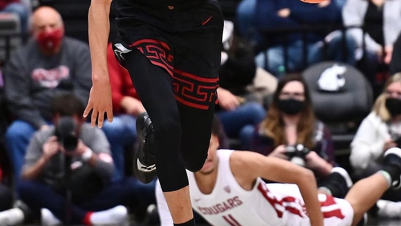 Dec 4, 2021; Pullman, Washington, USA; USC Trojans forward Max Agbonkpolo (23) brings the ball down court against the Washington State Cougars in the second half at Friel Court at Beasley Coliseum. USC won 63-61. Mandatory Credit: James Snook-USA TODAY Sports