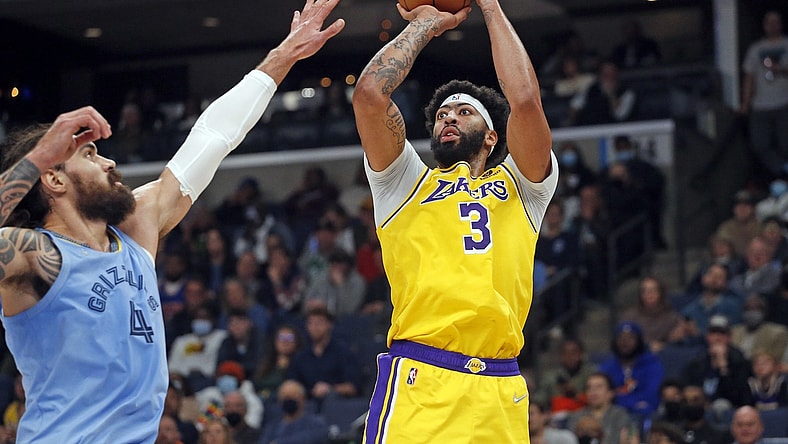 Dec 9, 2021; Memphis, Tennessee, USA; Los Angeles Lakers forward Anthony Davis (3) shoots the ball as Memphis Grizzles center Steven Adams (4) defends during the first half at FedExForum. Mandatory Credit: Petre Thomas-USA TODAY Sports