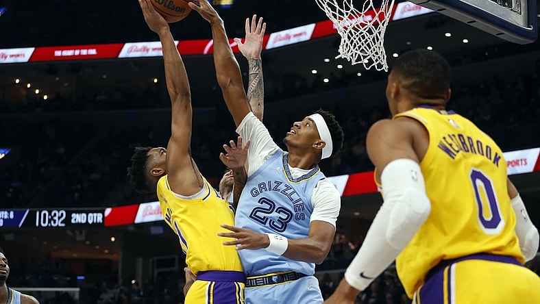 Dec 9, 2021; Memphis, Tennessee, USA; Memphis Grizzles guard Jarrett Culver (23) blocks the shot of Los Angeles Lakers guard Malik Monk (11) during the first half at FedExForum. Mandatory Credit: Petre Thomas-USA TODAY Sports