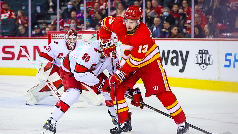 Dec 9, 2021; Calgary, Alberta, CAN; Calgary Flames left wing Johnny Gaudreau (13) controls the puck against the Carolina Hurricanes during the first period at Scotiabank Saddledome. Mandatory Credit: Sergei Belski-USA TODAY Sports
