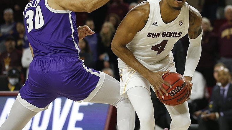 Dec 9, 2021; Tempe, AZ, United States; ASU's Kimani Lawrence (4) spins around GCU's Gabe McGlothan (30) during a game at Desert Financial Arena. Mandatory Credit: Patrick Breen-Arizona Republic

Asu V Gcu