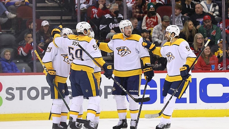 Dec 10, 2021; Newark, New Jersey, USA; Nashville Predators right wing Eeli Tolvanen (28) celebrates his goal against the New Jersey Devils during the second period at Prudential Center. Mandatory Credit: Ed Mulholland-USA TODAY Sports