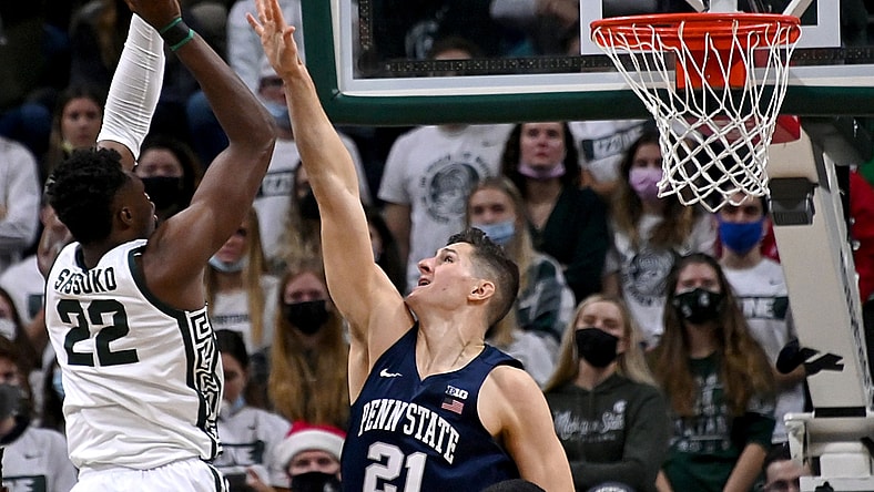 Dec 11, 2021; East Lansing, Michigan, USA;  Michigan State Spartans center Mady Sissoko (22) shoots over Penn State Nittany Lions forward John Harrar (21) in the first half at Jack Breslin Student Events Center. Mandatory Credit: Dale Young-USA TODAY Sports