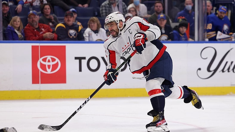 Dec 11, 2021; Buffalo, New York, USA;  Washington Capitals left wing Alex Ovechkin (8) takes a shot on goal during the third period against the Buffalo Sabres at KeyBank Center. Mandatory Credit: Timothy T. Ludwig-USA TODAY Sports