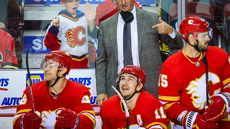 Dec 11, 2021; Calgary, Alberta, CAN; Calgary Flames head coach Darryl Sutter on his bench against the Boston Bruins during the third period at Scotiabank Saddledome. Mandatory Credit: Sergei Belski-USA TODAY Sports