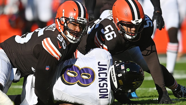 Dec 12, 2021; Cleveland, Ohio, USA; Cleveland Browns defensive end Myles Garrett (95) looks up to check the spot after tackling Baltimore Ravens quarterback Lamar Jackson (8) during the first quarter at FirstEnergy Stadium. Mandatory Credit: Ken Blaze-USA TODAY Sports