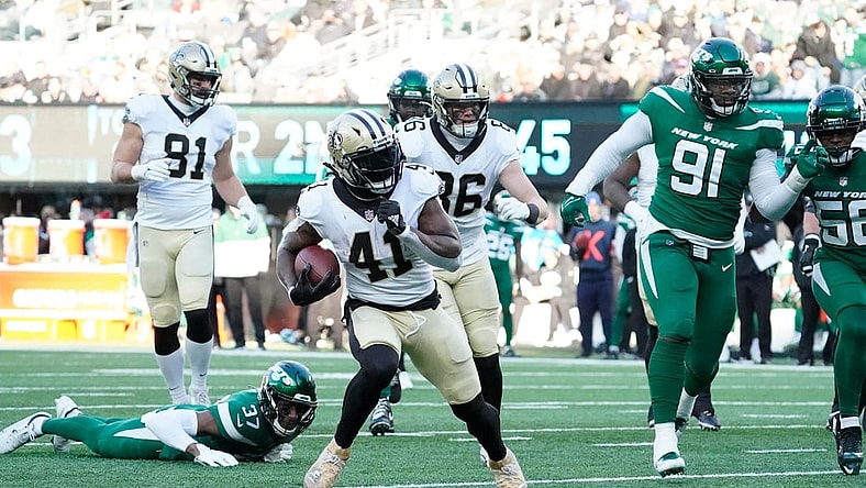 Dec 12, 2021; East Rutherford, N.J.,USA;  New Orleans Saints running back Alvin Kamara (41) scores a 1st half touchdown against the New York Jets at MetLife Stadium. Mandatory Credit: Robert Deutsch-USA TODAY Sports