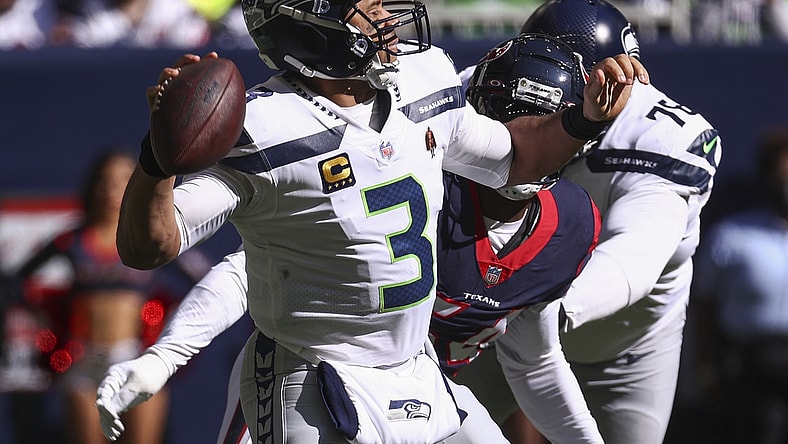 Dec 12, 2021; Houston, Texas, USA; Seattle Seahawks quarterback Russell Wilson (3) attempts a pass during the second quarter against the Houston Texans at NRG Stadium. Mandatory Credit: Troy Taormina-USA TODAY Sports
