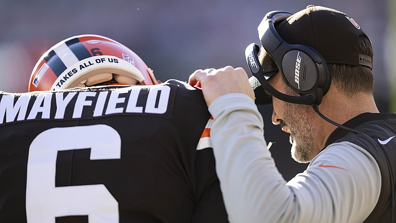 Dec 12, 2021; Cleveland, Ohio, USA; Cleveland Browns head coach Kevin Stefanski talks with quarterback Baker Mayfield (6) during the first quarter against the Baltimore Ravens at FirstEnergy Stadium. Mandatory Credit: Scott Galvin-USA TODAY Sports