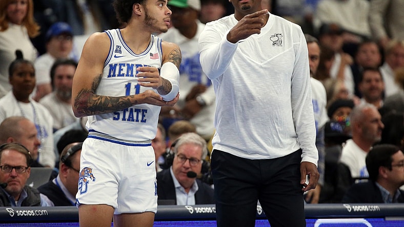 Dec 14, 2021; Memphis, Tennessee, USA; Memphis Tigers head coach Penny Hardaway talks with Memphis Tigers guard Lester Quinones (11) as he checks in during the first half against the Alabama Crimson Tide at FedExForum. Mandatory Credit: Petre Thomas-USA TODAY Sports