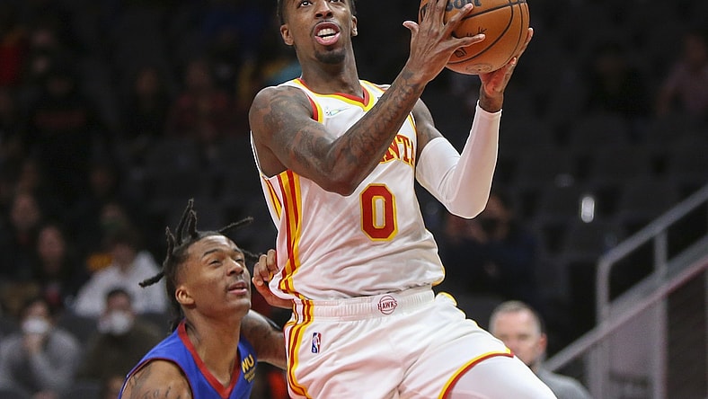 Dec 17, 2021; Atlanta, Georgia, USA; Atlanta Hawks guard Delon Wright (0) shoots against the Denver Nuggets in the second half at State Farm Arena. Mandatory Credit: Brett Davis-USA TODAY Sports