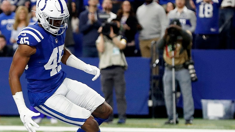 Indianapolis Colts linebacker E.J. Speed (45) rushes to dive on a blocked punt to score a touchdown Saturday, Dec. 18, 2021, during a game against the New England Patriots at Lucas Oil Stadium in Indianapolis.