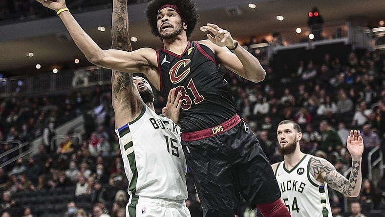 Dec 18, 2021; Milwaukee, Wisconsin, USA;  Cleveland Cavaliers center Jarrett Allen (31) takes a shot against Milwaukee Bucks center DeMarcus Cousins (15) in the fourth quarter at Fiserv Forum. Mandatory Credit: Benny Sieu-USA TODAY Sports