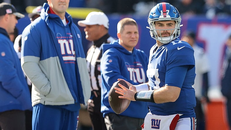 Dec 19, 2021; East Rutherford, New Jersey, USA; New York Giants quarterback Jake Fromm (17) throws the ball as quarterback Daniel Jones (8) looks on before the game against the Dallas Cowboys at MetLife Stadium. Mandatory Credit: Vincent Carchietta-USA TODAY Sports
