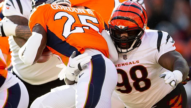 Cincinnati Bengals nose tackle D.J. Reader (98) tackles Denver Broncos running back Melvin Gordon (25) in the first half the NFL football game between the Cincinnati Bengals and the Denver Broncos on Sunday, Dec. 19, 2021, at Empower Field in Denver, Co.

Cincinnati Bengals At Denver Broncos 371