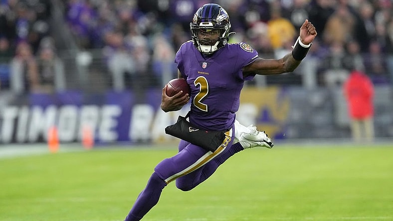 Dec 19, 2021; Baltimore, Maryland, USA; Baltimore Ravens quarterback Tyler Huntley (2) runs the ball in the first quarter against the Green Bay Packers at M&T Bank Stadium. Mandatory Credit: Mitch Stringer-USA TODAY Sports