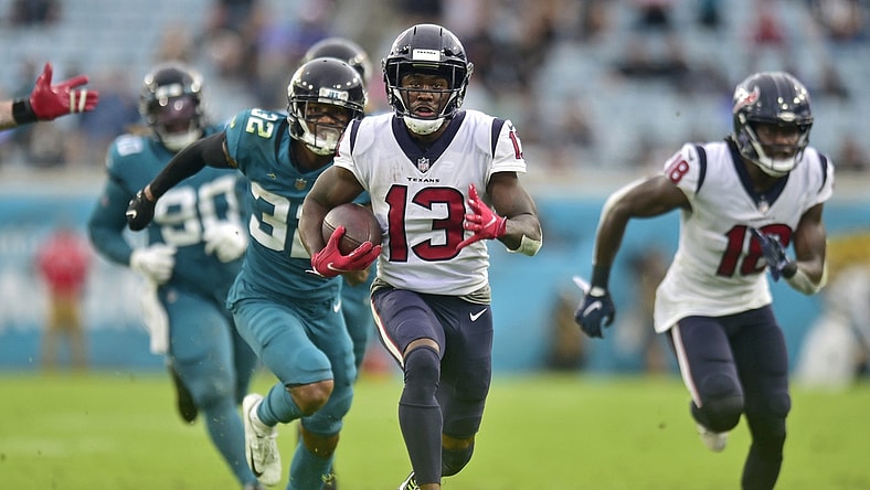 Houston Texans wide receiver Brandin Cooks (13) scores the final touchdown for Houston as Jacksonville Jaguars cornerback Tyson Campbell (32) can't make the tackle during the fourth quarter Sunday, Dec. 2021 at TIAA Bank Field in Jacksonville. The Jaguars hosted the Texans during a regular season NFL game. Houston defeated Jacksonville 30-16. [Corey Perrine/Florida Times-Union]Jki 121921 Jagstexans 26