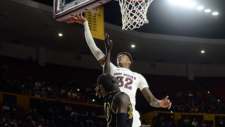 Dec 19, 2021; Tempe, Arizona, USA; Arizona State Sun Devils forward Alonzo Gaffney (32) grabs a rebound over San Francisco Dons forward Josh Kunen (10) during the first half at Desert Financial Arena. Mandatory Credit: Joe Camporeale-USA TODAY Sports
