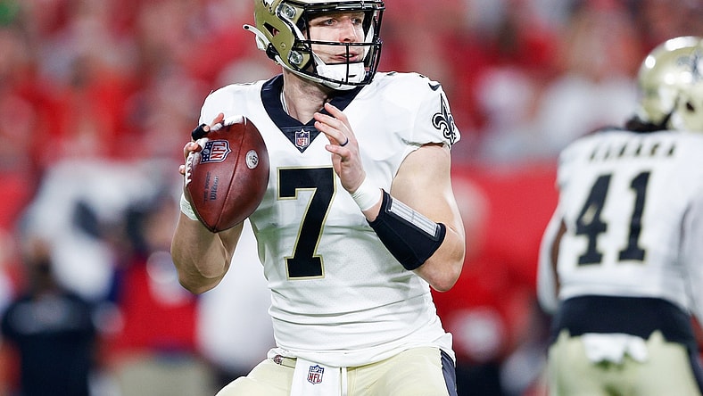 Dec 19, 2021; Tampa, Florida, USA;  New Orleans Saints quarterback Taysom Hill (7) drops back to pass in the first quarter against the Tampa Bay Buccaneers at Raymond James Stadium. Mandatory Credit: Nathan Ray Seebeck-USA TODAY Sports