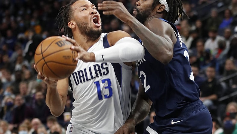 Dec 19, 2021; Minneapolis, Minnesota, USA; Dallas Mavericks guard Jalen Brunson (13) works around Minnesota Timberwolves guard Patrick Beverley (22) in the first quarter at Target Center. Mandatory Credit: Bruce Kluckhohn-USA TODAY Sports