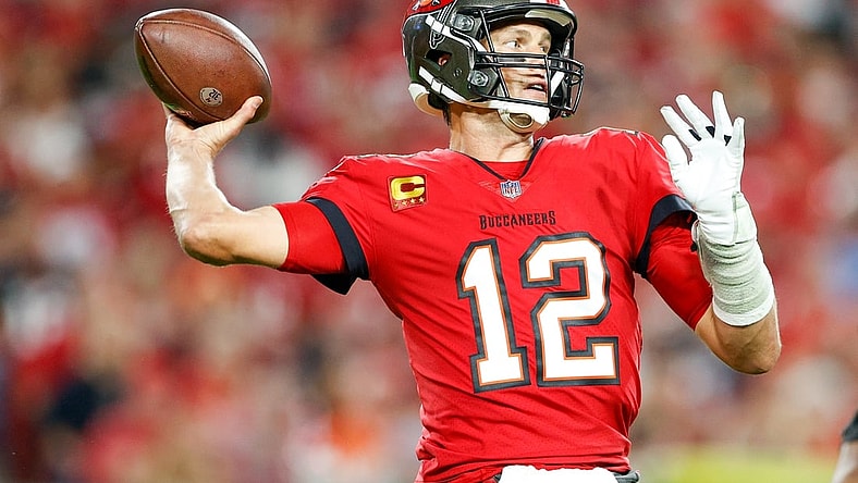 Dec 19, 2021; Tampa, Florida, USA;  Tampa Bay Buccaneers quarterback Tom Brady (12) attempts a pass in the first half against the New Orleans Saints at Raymond James Stadium. Mandatory Credit: Nathan Ray Seebeck-USA TODAY Sports