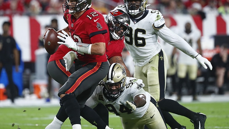 Dec 19, 2021; Tampa, Florida, USA; New Orleans Saints defensive end Cameron Jordan (94) sacks Tampa Bay Buccaneers quarterback Tom Brady (12) during the first half at Raymond James Stadium. Mandatory Credit: Kim Klement-USA TODAY Sports