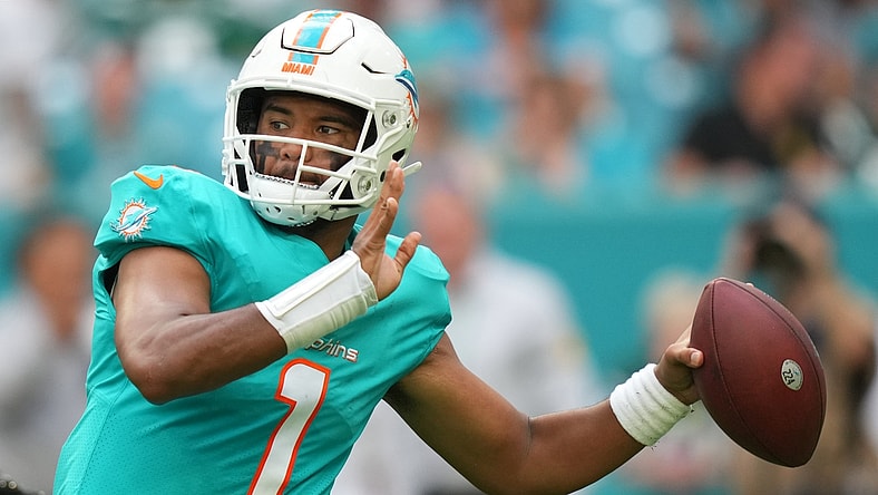 Dec 19, 2021; Miami Gardens, Florida, USA; Miami Dolphins quarterback Tua Tagovailoa (1) attempts a pass against the New York Jets during the second half at Hard Rock Stadium. Mandatory Credit: Jasen Vinlove-USA TODAY Sports