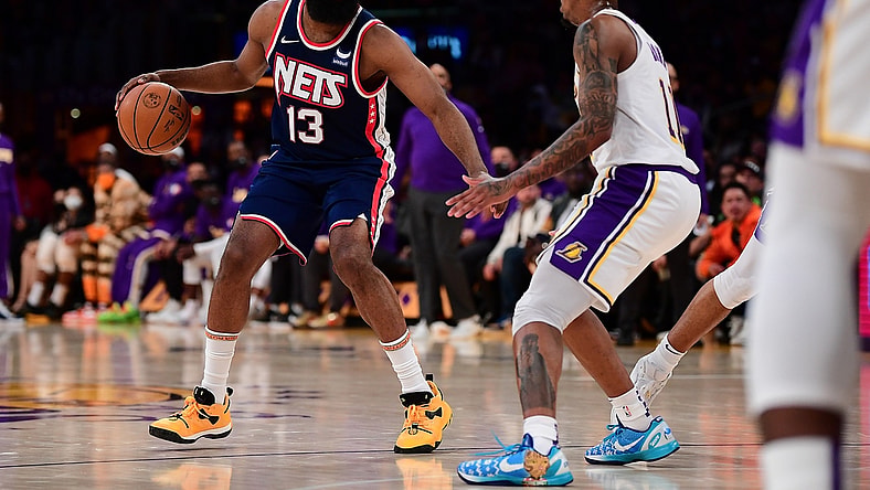 Dec 25, 2021; Los Angeles, California, USA; Brooklyn Nets guard James Harden (13) controls the ball against Los Angeles Lakers guard Malik Monk (11) during the first half at Crypto.com Arena. Mandatory Credit: Gary A. Vasquez-USA TODAY Sports