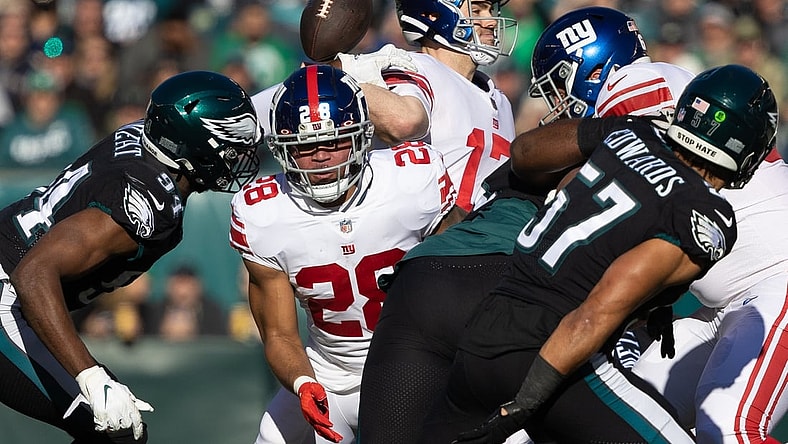Dec 26, 2021; Philadelphia, Pennsylvania, USA; Philadelphia Eagles defensive end Josh Sweat (94) knocks the ball away from the pass attempt of New York Giants quarterback Jake Fromm (17) during the first quarter at Lincoln Financial Field. Mandatory Credit: Bill Streicher-USA TODAY Sports