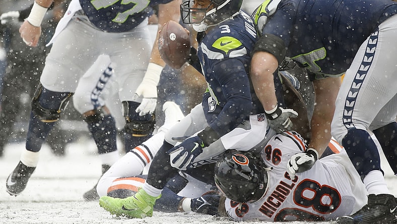 Dec 26, 2021; Seattle, Washington, USA; Seattle Seahawks quarterback Russell Wilson (3) is sacked by Chicago Bears defensive end Bilal Nichols (98) during the first quarter at Lumen Field. Mandatory Credit: Joe Nicholson-USA TODAY Sports